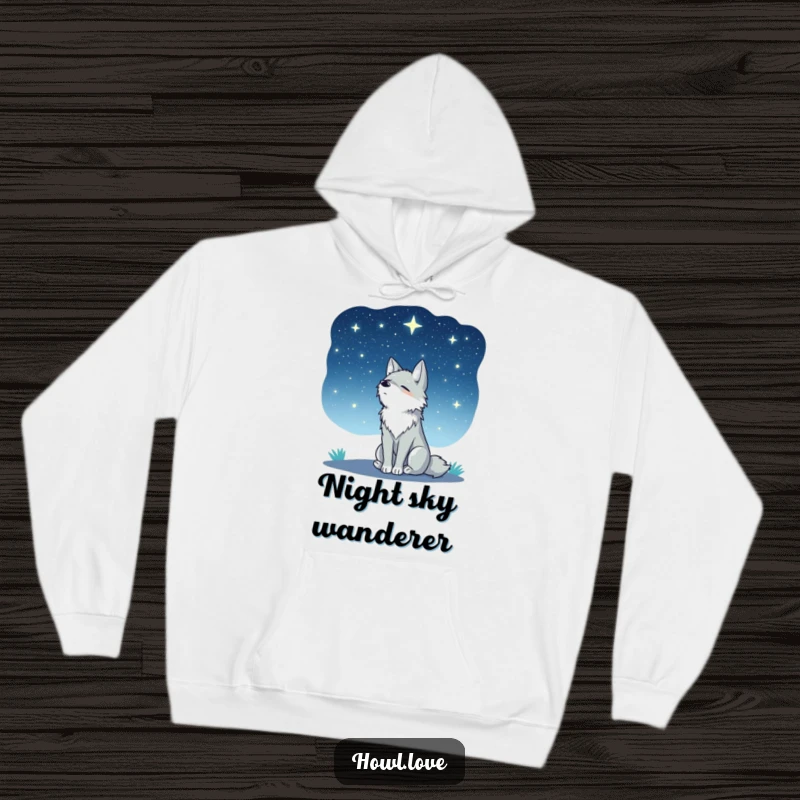 Funny hoodie depicting a peaceful wolf sitting in silhouette, gazing contemplatively at a vast, star-dusted night sky. Cozy and serene.